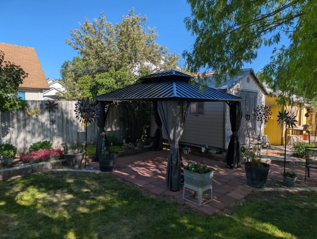 Completed backyard gazebo and landscaping project by The Nelsons Crew
