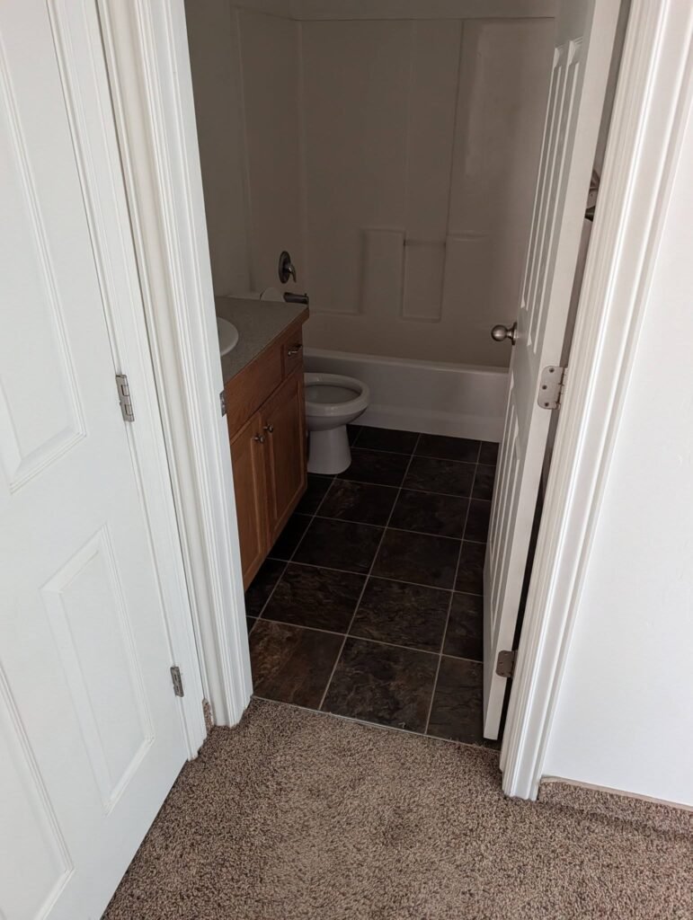 Bathroom before an investment property renovation by The Nelsons Crew in Brigham City, Utah