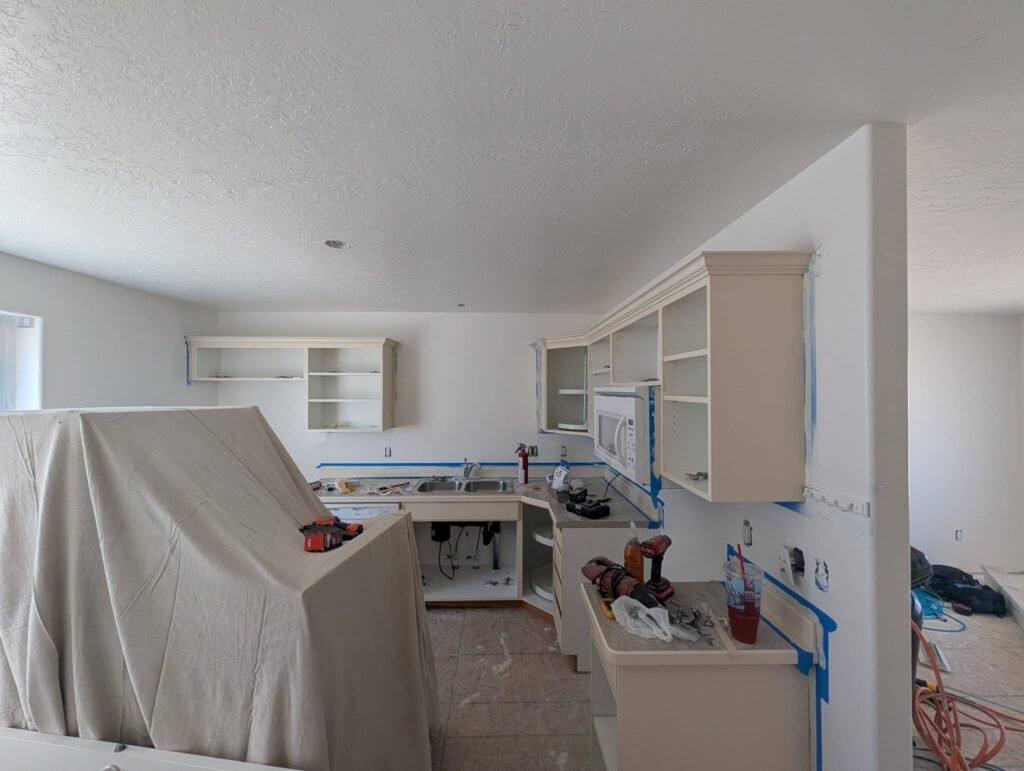 Kitchen cabinets being refinished during an investment property renovation by The Nelsons Crew