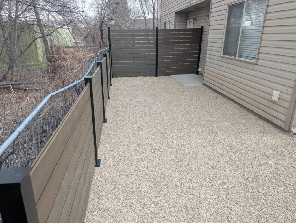 Modern horizontal privacy fence and low-maintenance xeriscaping installed by The Nelsons Crew
