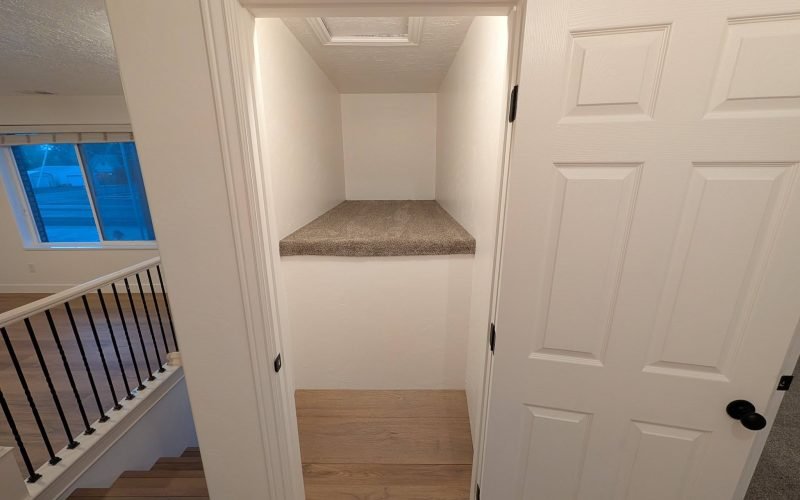 Finished interior renovation with new flooring, paint and refinished railing by The Nelsons Crew