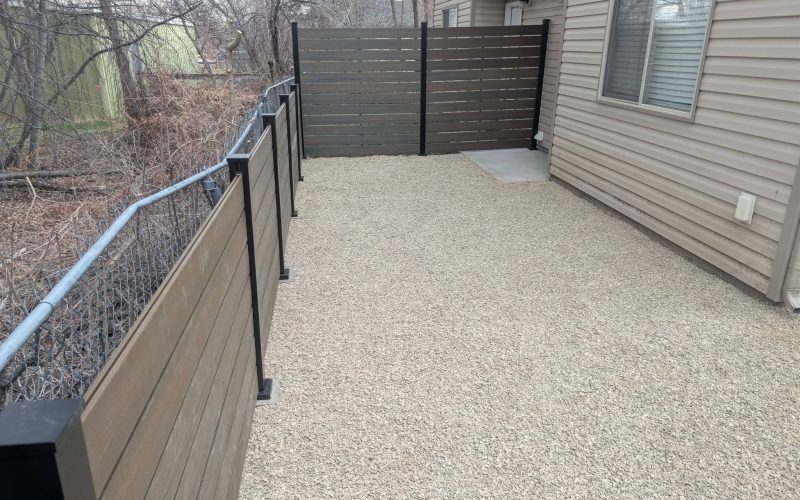 Modern horizontal privacy fence and low-maintenance xeriscaping installed by The Nelsons Crew